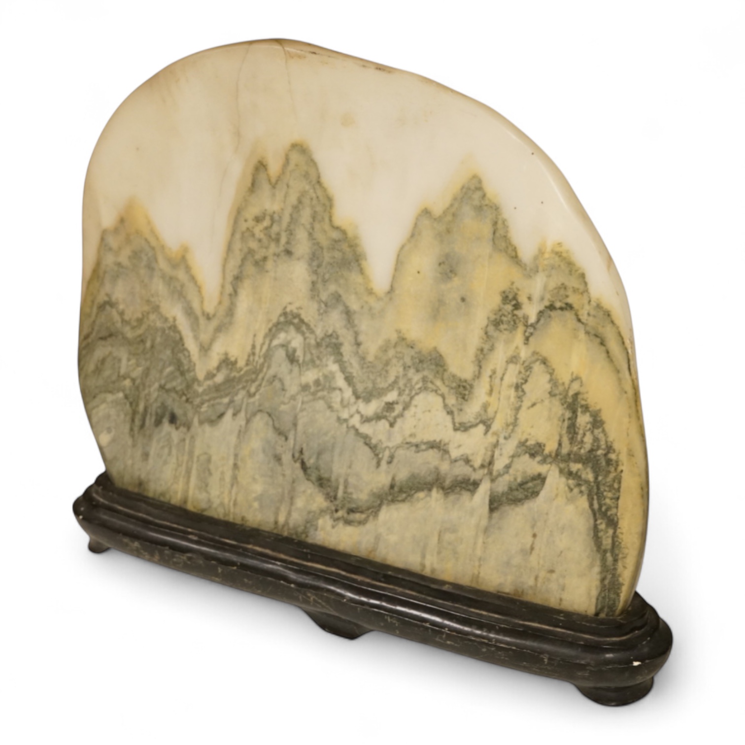 A Chinese dreamstone carving on stand, 38cm wide